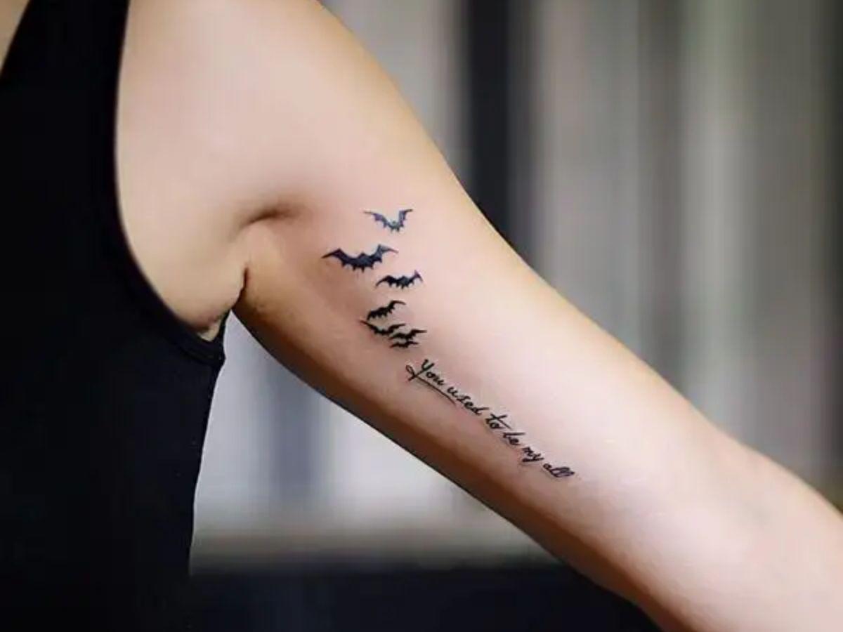 Xăm chữ ý nghĩa mặt trong bắp tay